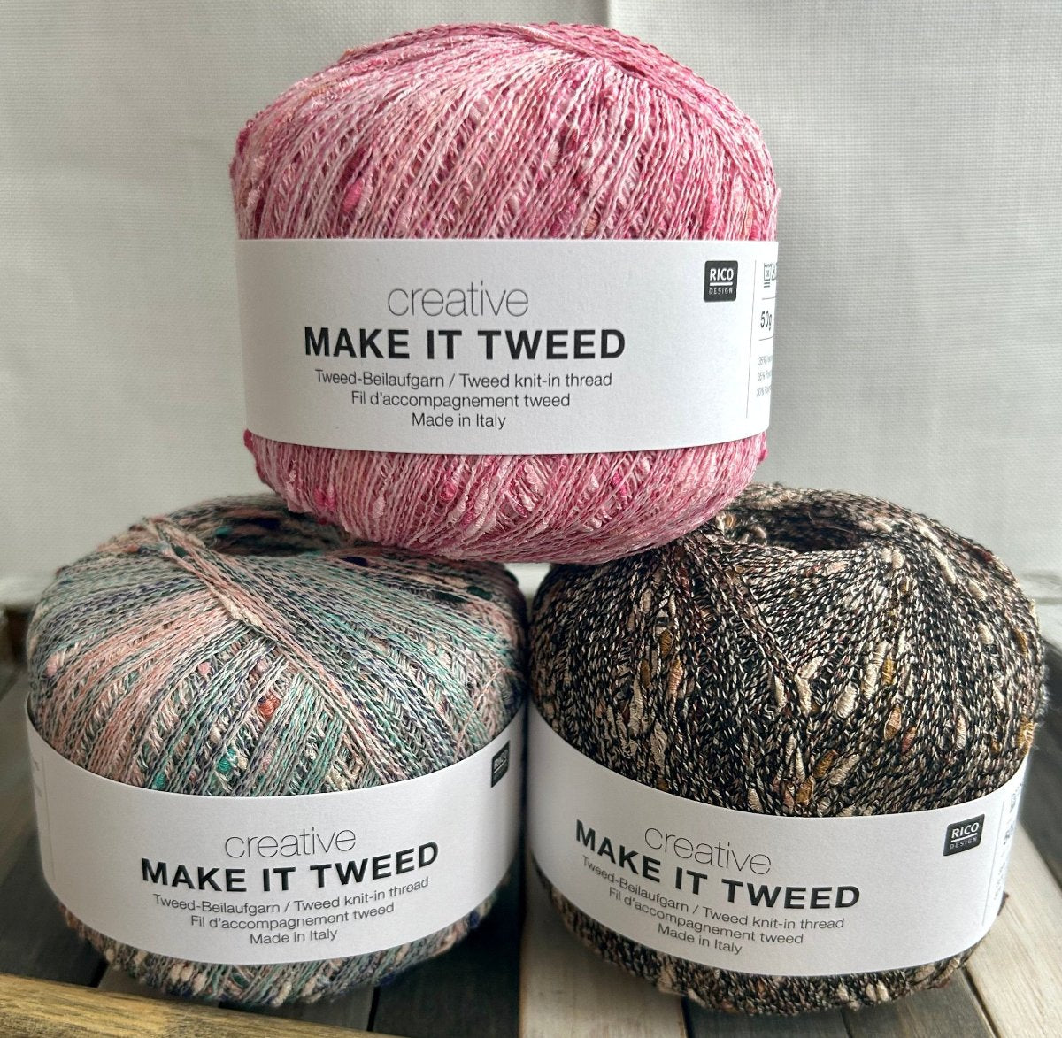 3 balls of Rico Make it Tweed stacked and on display.